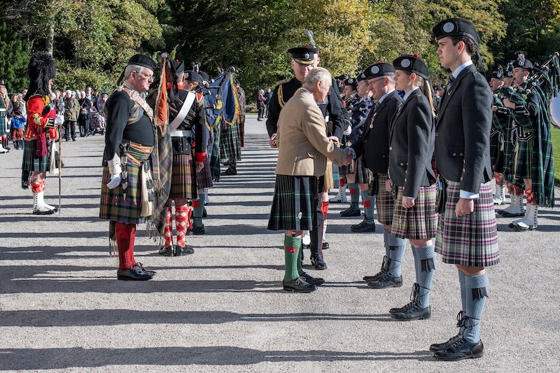 Pipers strike a chord with the King after being awarded special Coronation Medals